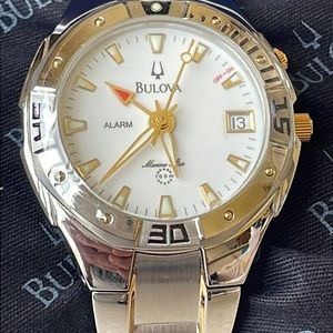 Bulova lady battery water resistant 100m silver and gold alarm w/date